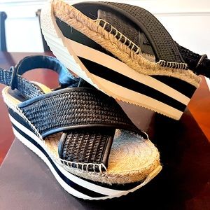 Sandals with wedge heels. Never worn. Very light weight and comfortable.